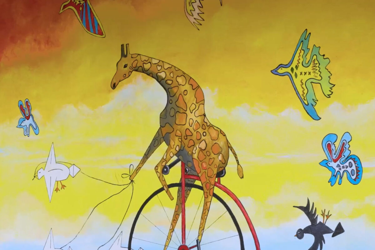 Mattie the giraffe sky mural at Destin Commons
